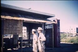 バラックの看板を見るフェーレイスと友人 / Faillace and His Friend Looking at the Barracks Signboard image
