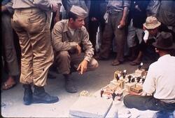 ヤミ市の商品を見るアメリカ兵 / American Soldiers Looking at Black Market Goods image