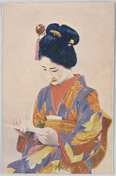 折り鶴を持つ女性 / Woman Holding an Origami Crane image