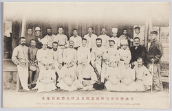 日本松山収容所病室職員及俘虜将校負傷者　THE　HOSPITAL　STAFF　AND　WOUNDED　OFFICER-CAPTIVES　AT　MATSUYAMA,　JAPAN. / Medical Ward Staff and Wounded Captive Officers in the Prisoner-of-War Camp, Matsuyama, Japan image