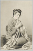 A JAPANESE HOUSEWIFE SEWING CLOTH.  image