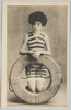 浮輪を持つ水着の女性/Woman in a Swimsuit Holding a Float image