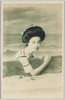 板を持つ水着の女性/Woman in a Swimsuit Holding a Board image