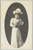 花籠を持つ洋装の女性/Woman in Western Clothing Holding a Flower Basket image