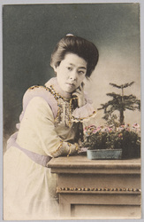 頬杖をつく洋装女性 / Woman in Western Dress Resting Her Cheek on Her Hand image