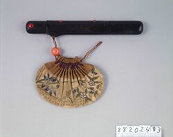 古代裂虫に秋花文百ひだ巾着型腰差したばこ入れ / Pleated Ancient Cloth Drawstring Pouch-shaped Tobacco Pouch with Insects and Autumn Flower Pattern, with Pipe Case image