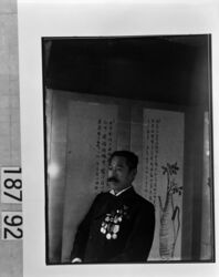 屏風前の勲章をつけた男性 / Man Wearing Medals in Front of a Folding Screen image