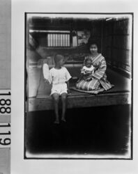 幼児を抱く女性と少年 / Boy with Woman Holding an Infant image