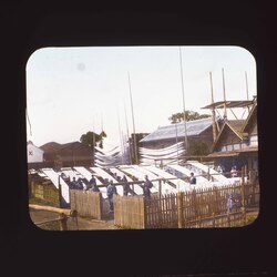 屋外で反物を干す男性たち / Men Drying Fabric Outdoors image