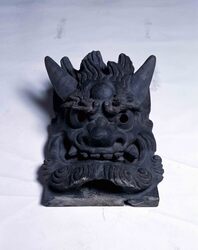 旧浅草寺観音堂降り棟鬼瓦(降り隅) / Onigawara (Ogre-Faced Roof Tile) of Descending Corner Ridge at Former Sensōji Temple Kannondō Hall (Kudarioni) image