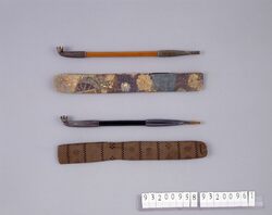 片輪車に桜染革煙管筒並びに煙管 / Leather Pipe Case with Monocycle and Cherry Blossom Pattern and Pipe image