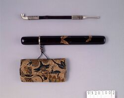 相良縫草花模様腰差したばこ入れ並びに煙管 / Sagara Embroidery Tobacco Pouch with Plant and Flower Pattern and Pipe, with Pipe Case image