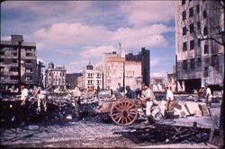 都心で後片付けをする男性 / Man Cleaning Up in the City Centre image